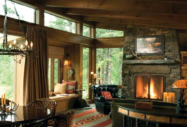 A cozy alternative to the soaring great room hearth, this one-story fireplace is the perfect size for this casual Montana getaway. Photo by Heidi Long.